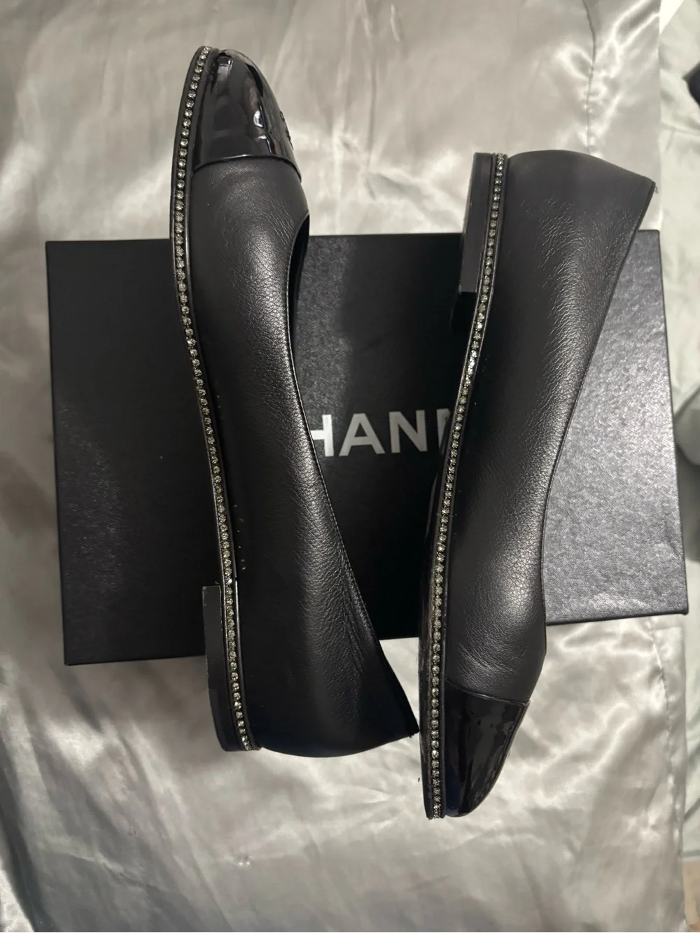 CHANEL Black Leather Ballet Flats with Patent Cap Toe